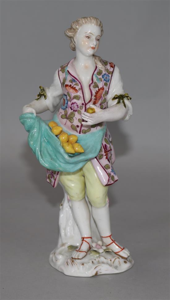 A 19th century German porcelain figure of a lemon seller (arm restored)